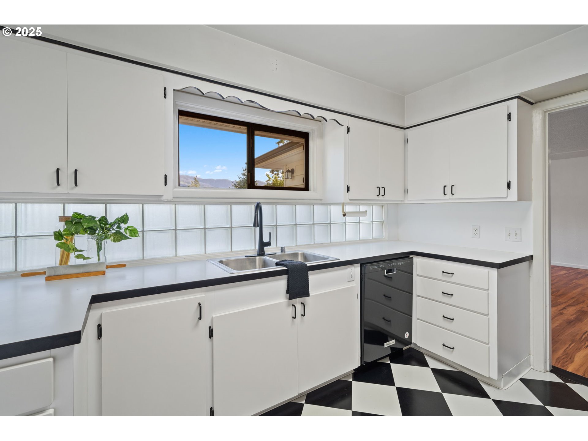 402 Skelton Road Stevenson, WA 98648 - Photo 12 of 48 a kitchen with a sink a stove and cabinets