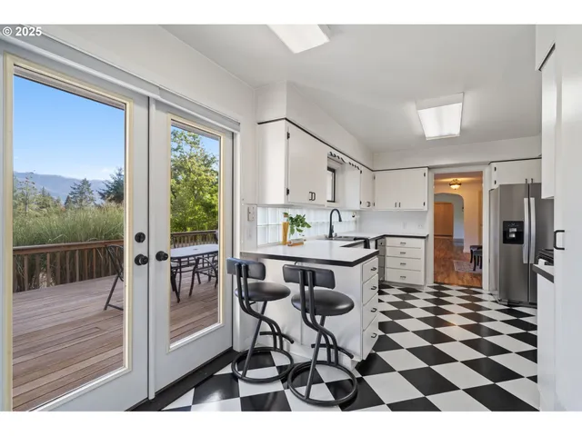 a dining room with a table and chairs