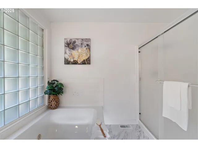 a bed room with a bed and a window