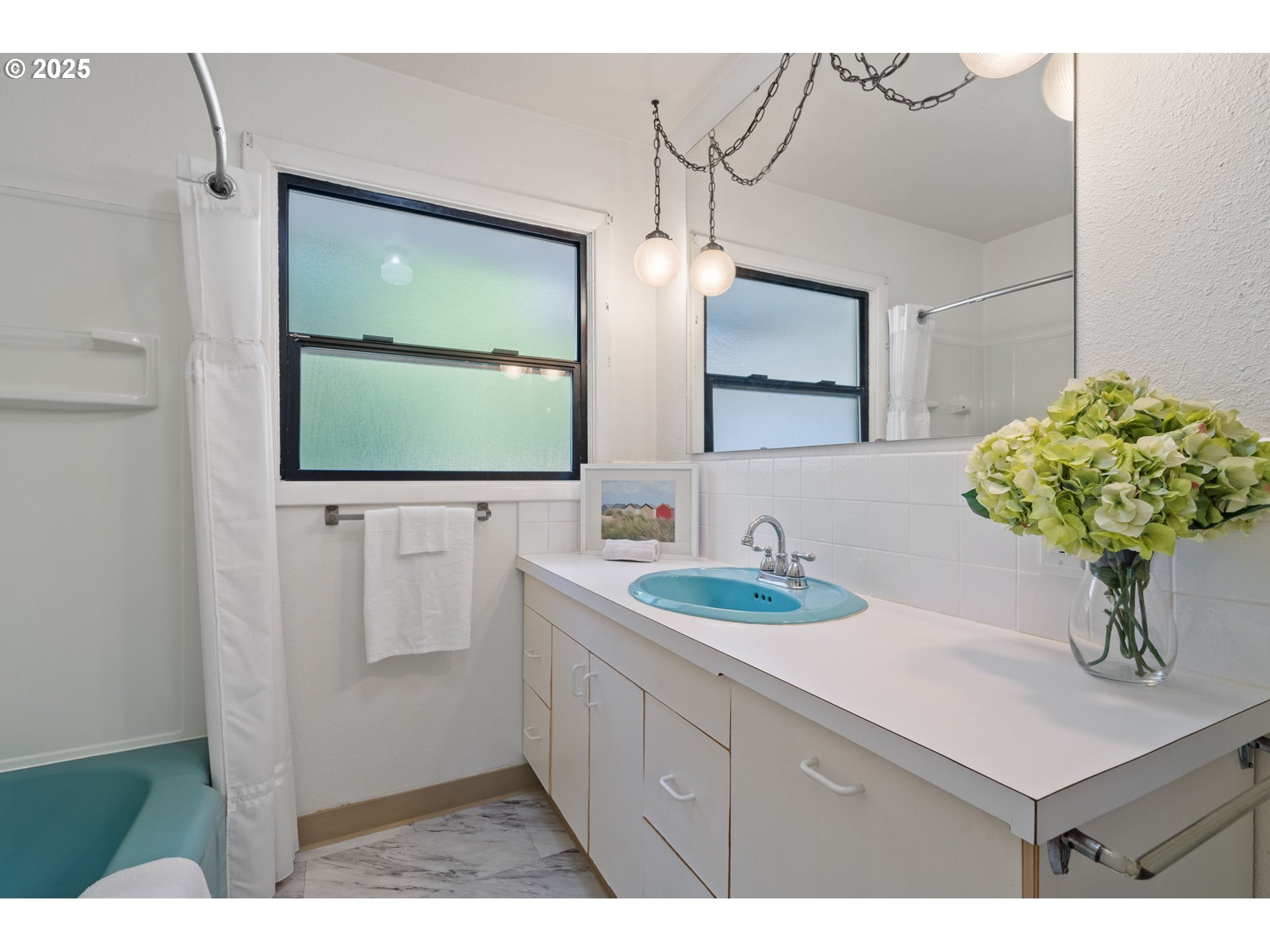 402 Skelton Road Stevenson, WA 98648 - Photo 25 of 48 a bathroom with a sink a mirror and a potted plant