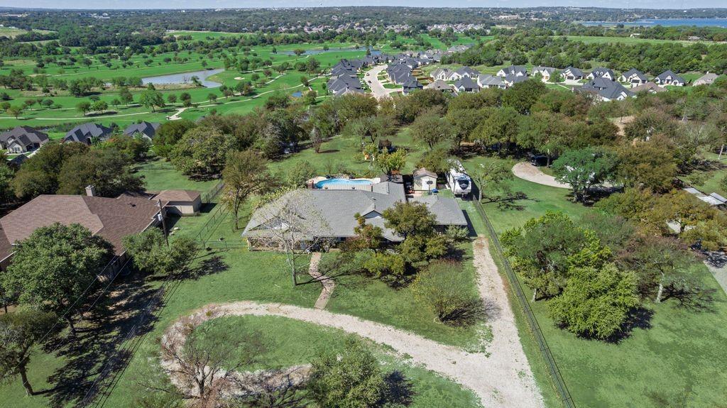 83 Crown Road Willow Park, TX 76087 - Photo 24 of 35 Expansive property featuring a private swimming pool, mature trees, and a detached structure