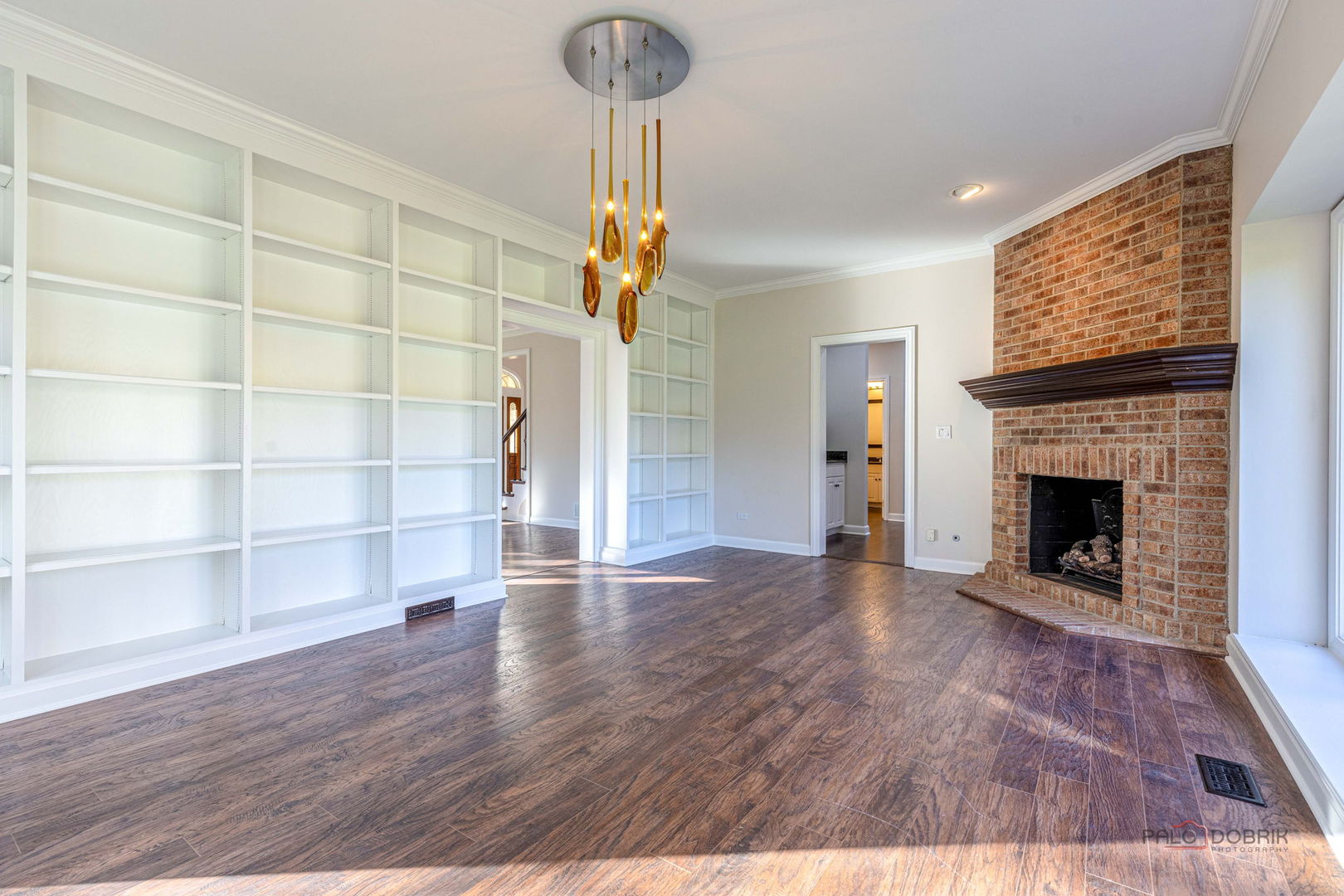 12 Riderwood Road North Barrington, IL 60010 - Photo 11 of 44 a view of an empty room with wooden floor fireplace and a window