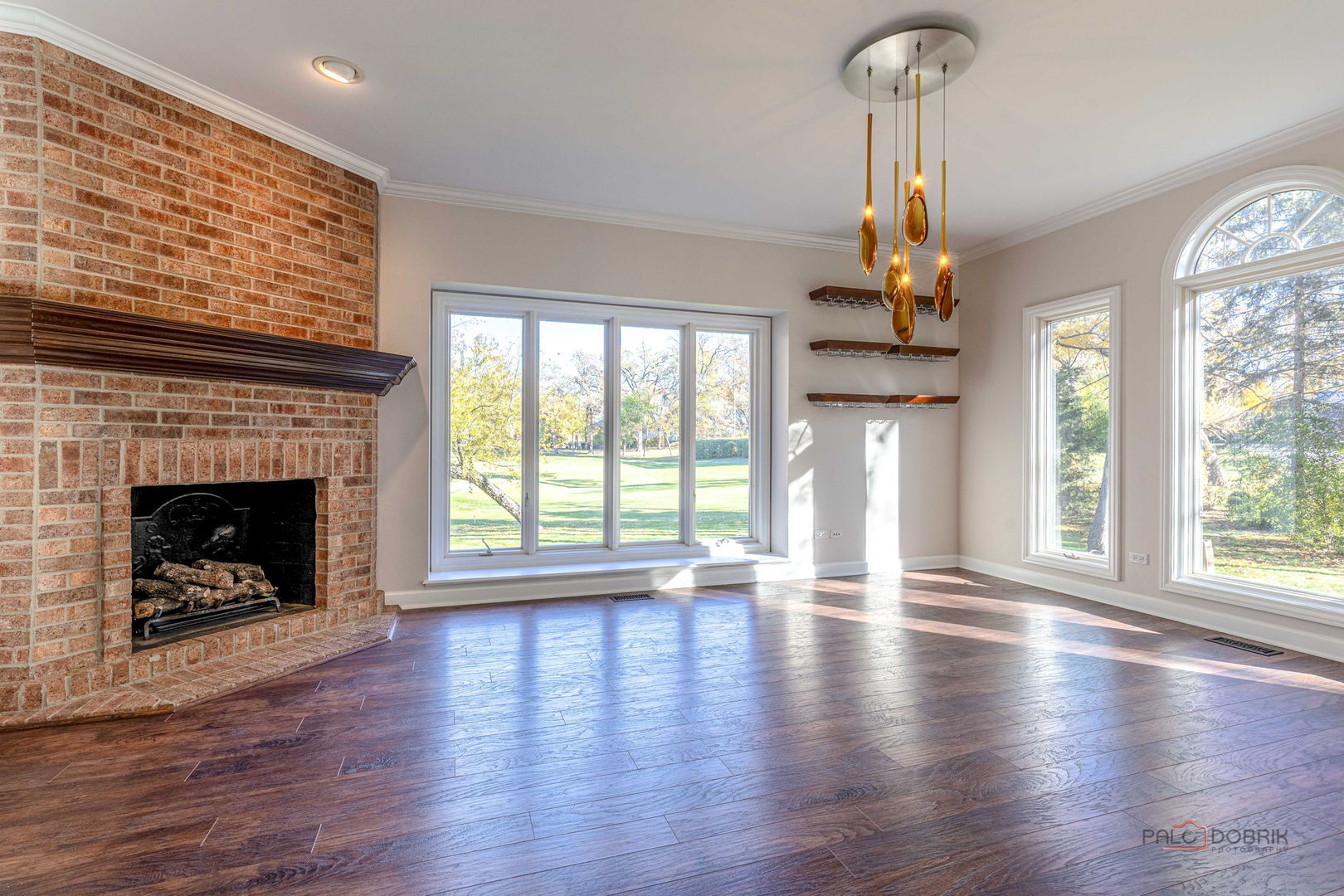 12 Riderwood Road North Barrington, IL 60010 - Photo 12 of 44 a view of an empty room with a window and wooden floor