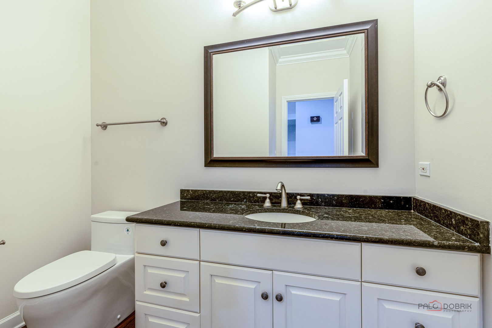 12 Riderwood Road North Barrington, IL 60010 - Photo 20 of 44 a bathroom with a toilet sink vanity and mirror