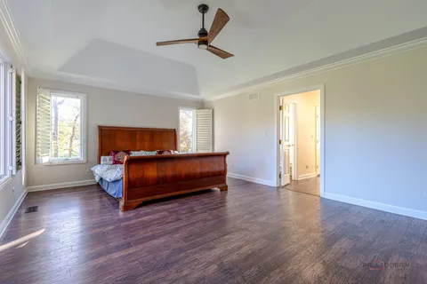 a bedroom with bed and window