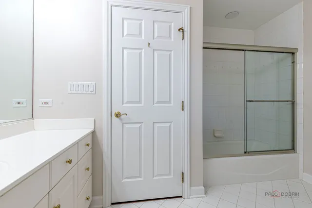 a bathroom with a shower and a tub