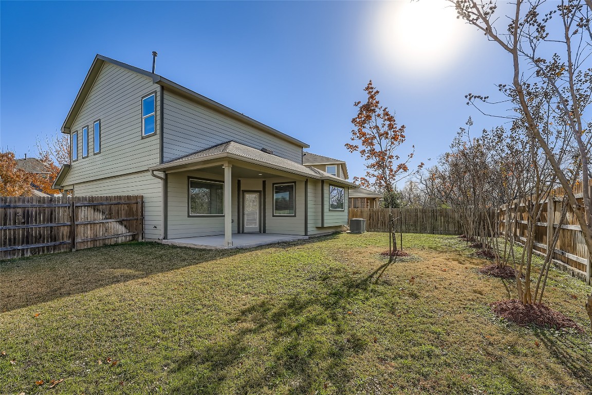 14601 Frankel Loop Pflugerville, TX 78660 - Photo 12 of 17 Back of house featuring a fenced backyard and a patio