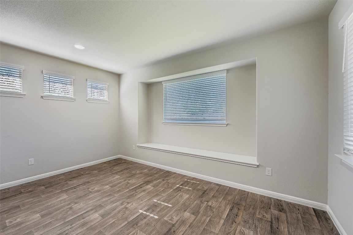 14601 Frankel Loop Pflugerville, TX 78660 - Photo 3 of 17 Unfurnished room featuring wood finished floors and recessed lighting