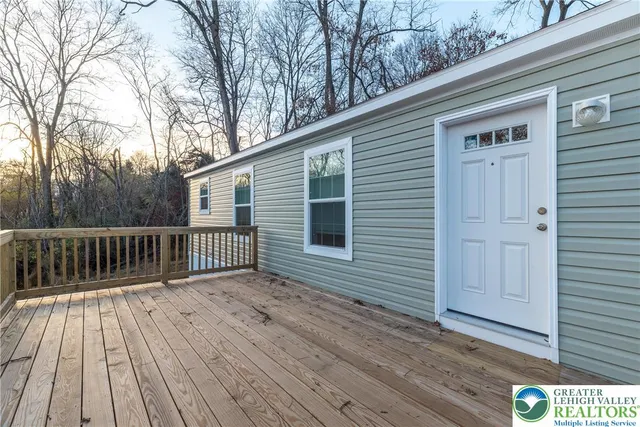 a view of backyard with a deck