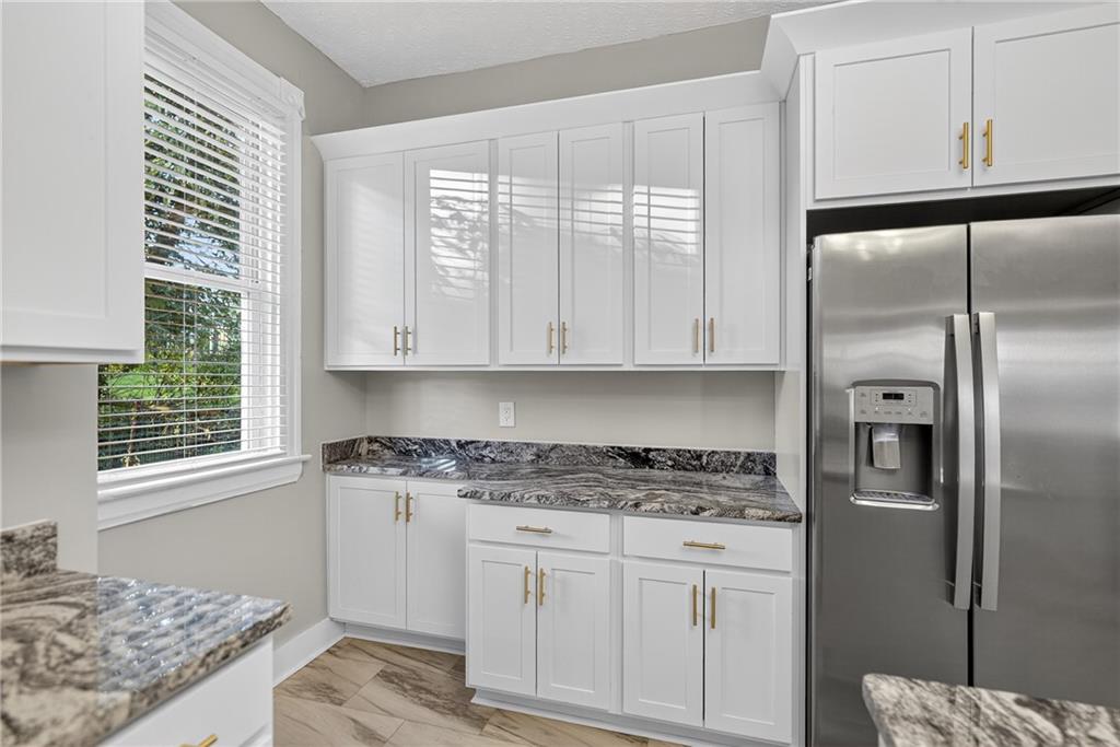 1331 Pritchard Street Pittsburgh, PA 15204 - Photo 19 of 49 a kitchen with stainless steel appliances granite countertop a stove a refrigerator and a microwave