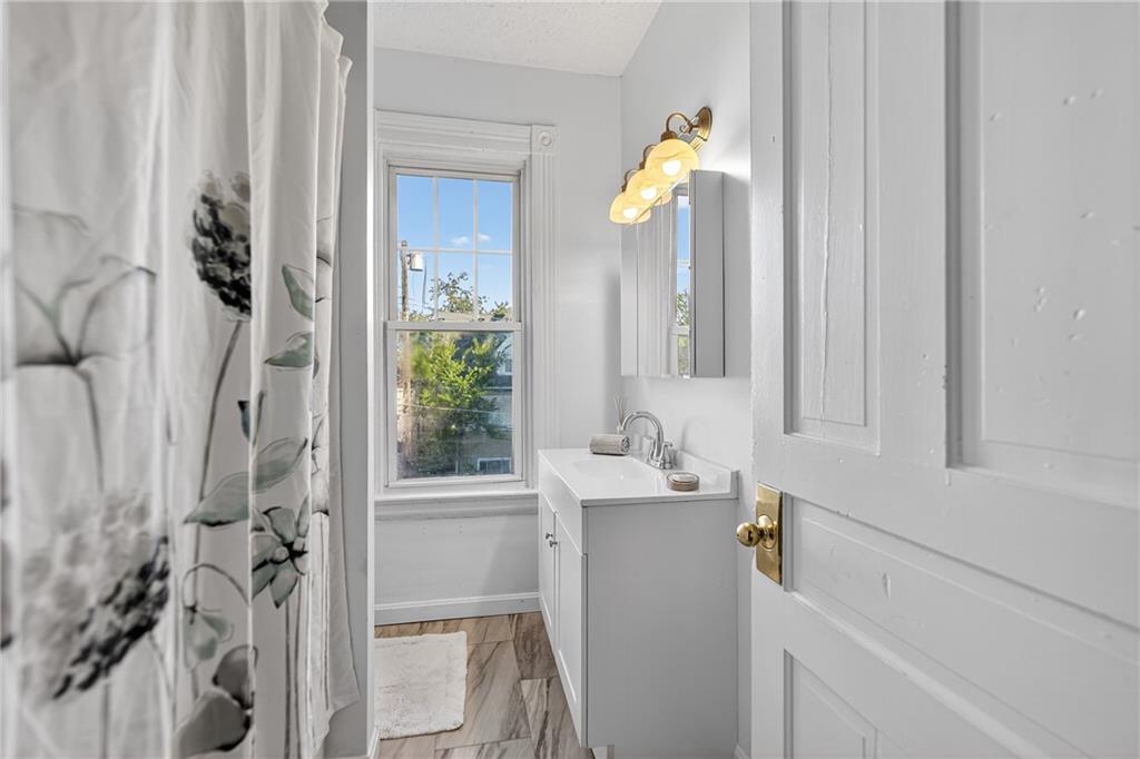 1331 Pritchard Street Pittsburgh, PA 15204 - Photo 28 of 49 a bathroom with a sink and a mirror