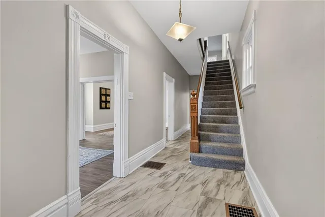 a view of an entryway with wooden floor