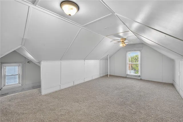 an empty room with windows and entrance