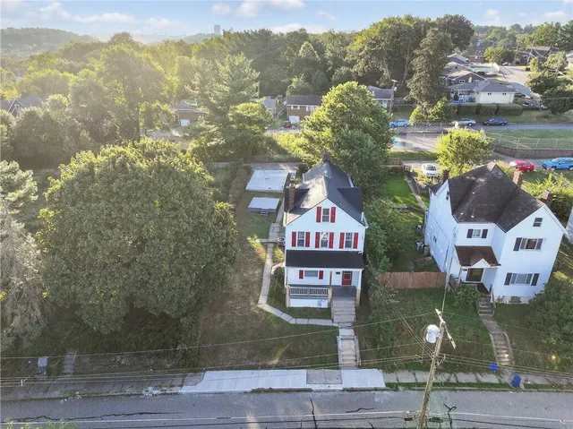 a view of a wooden deck with a yard