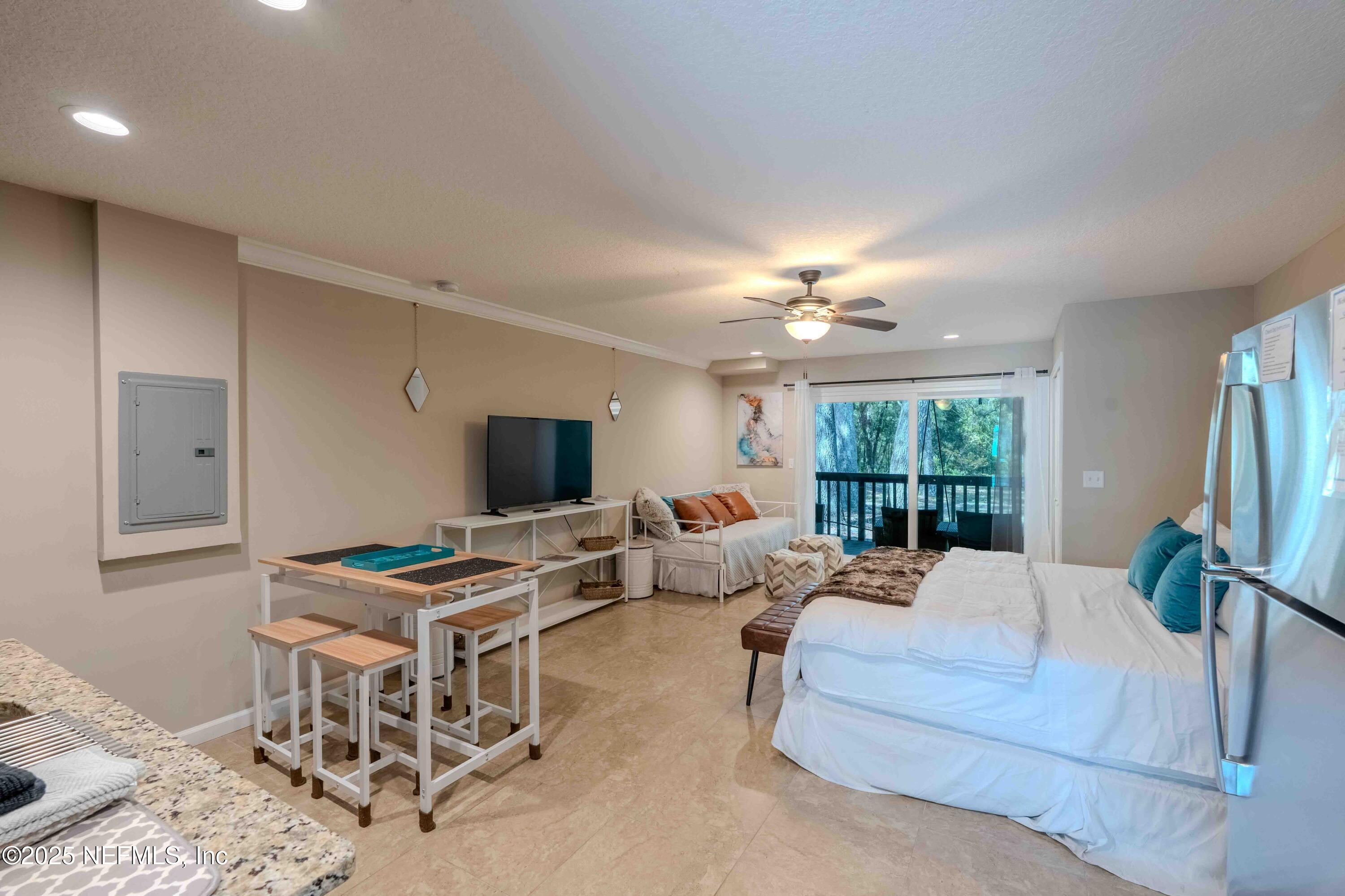 3145 Ravines Road Middleburg, FL 32068 - Photo 14 of 26 a living room with furniture and a chandelier