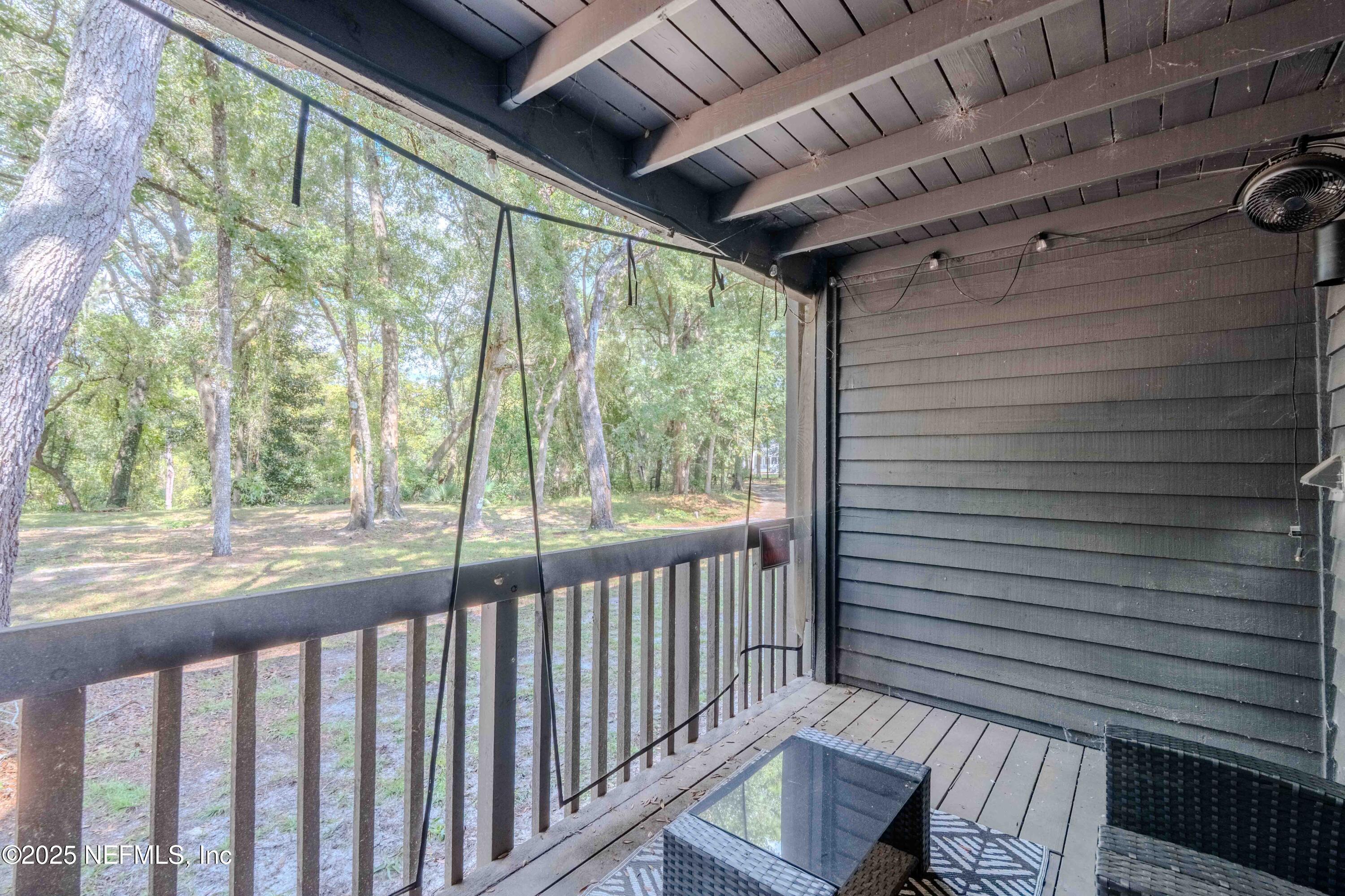 3145 Ravines Road Middleburg, FL 32068 - Photo 20 of 26 a view of a porch with wooden floor and outdoor space