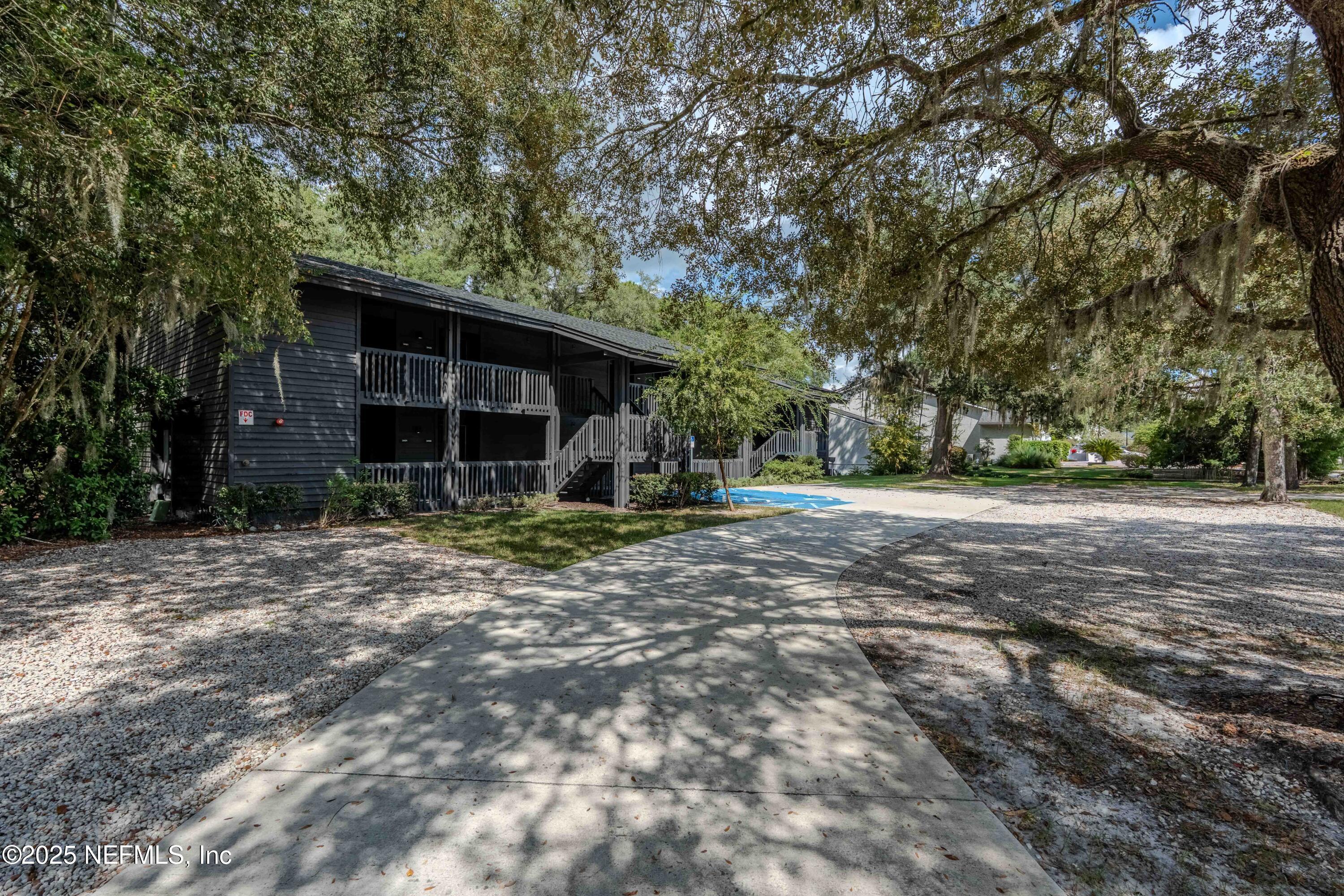 3145 Ravines Road Middleburg, FL 32068 - Photo 3 of 26 a front view of a house with a yard and garage