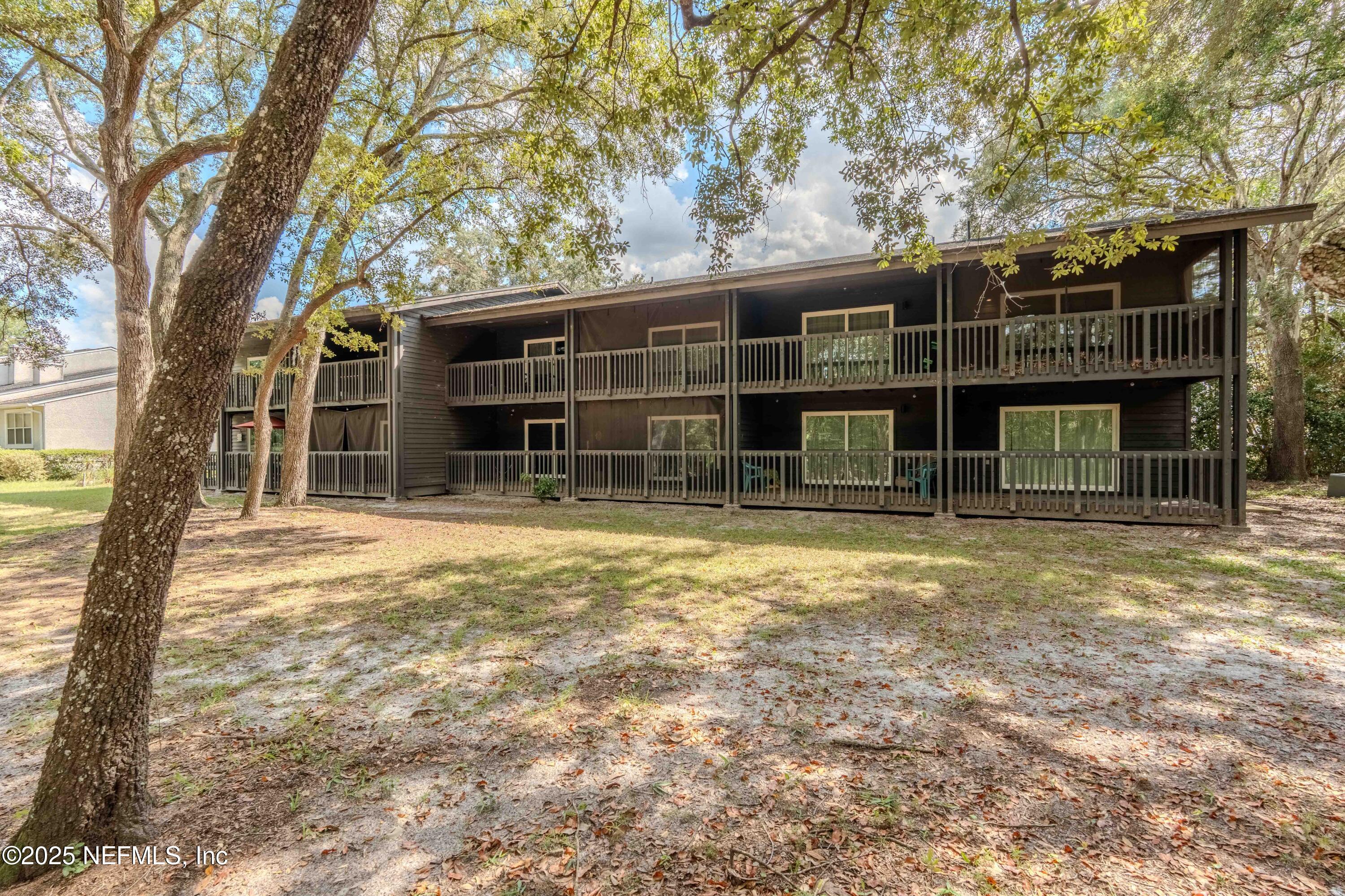3145 Ravines Road Middleburg, FL 32068 - Photo 8 of 26 front view of a house with a yard and large trees