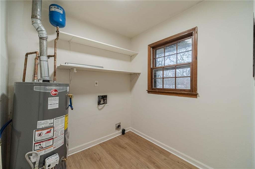 1678 Pounds Road Southwest Stone Mountain, GA 30087 - Photo 11 of 25 a view of storage and utility room with washer and dryer