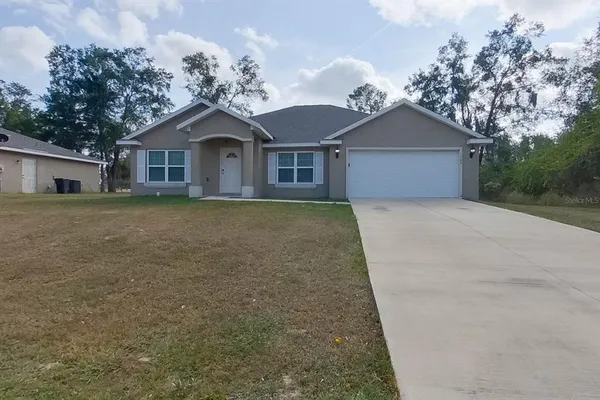 front view of a house with a yard