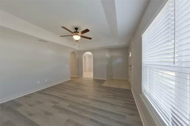 a view of an empty room with a window