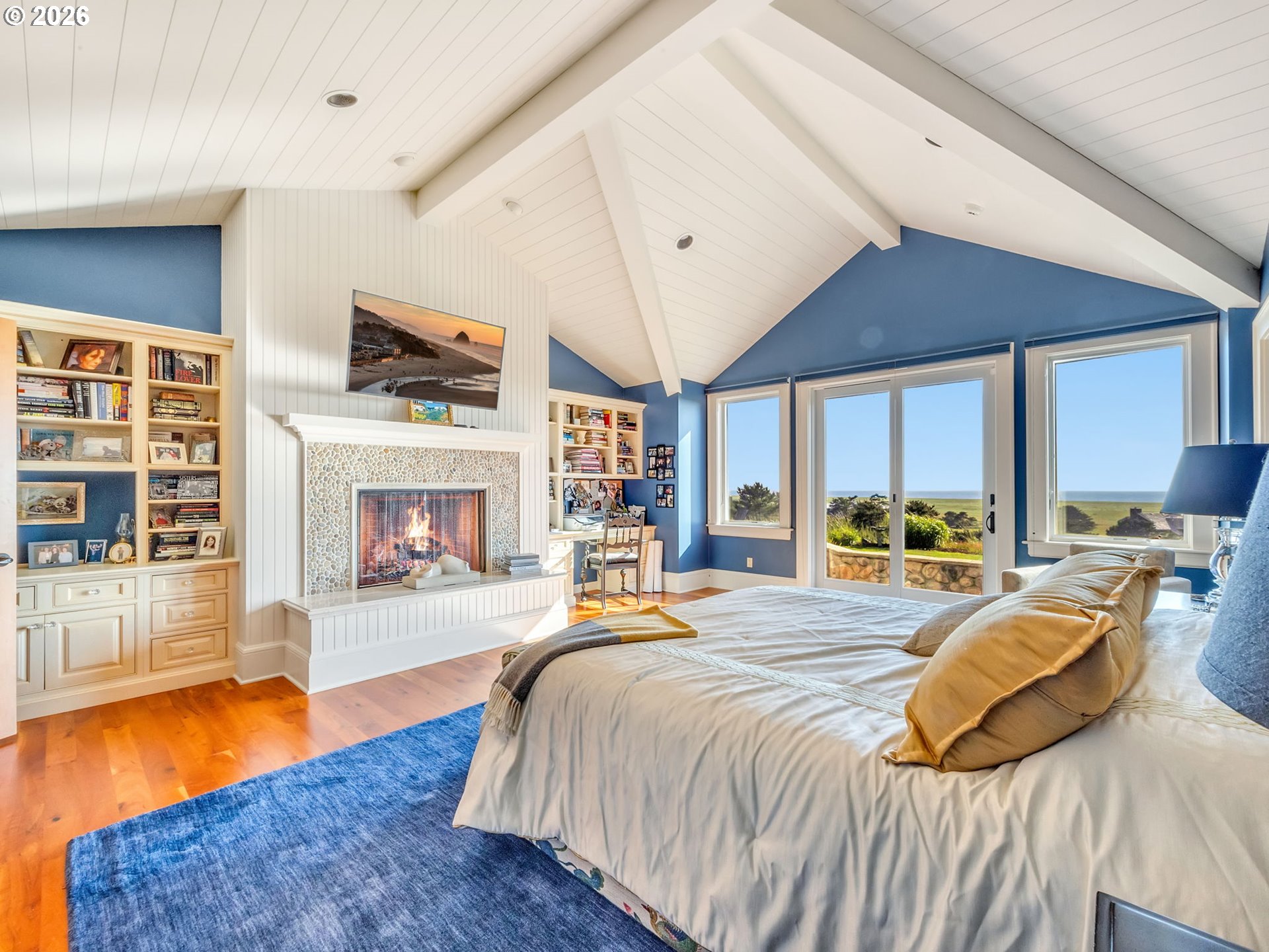 89079 Pinehurst Road Warrenton, OR 97146 - Photo 27 of 46 a bedroom with a bed and a fireplace