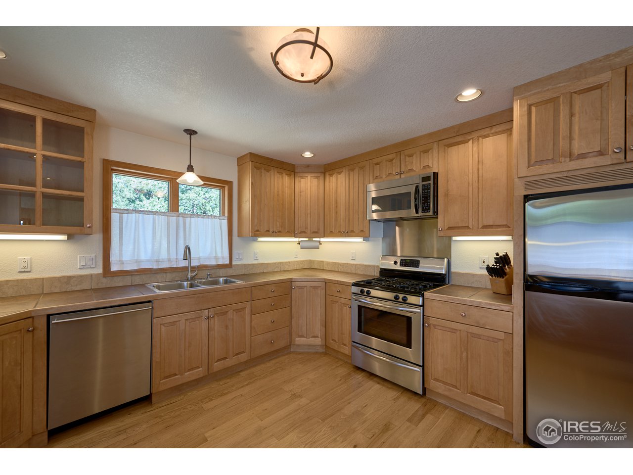 1580 Ridge Road Nederland, CO 80466 - Photo 10 of 31 Kitchen - Gas Range + Maple Cabinets