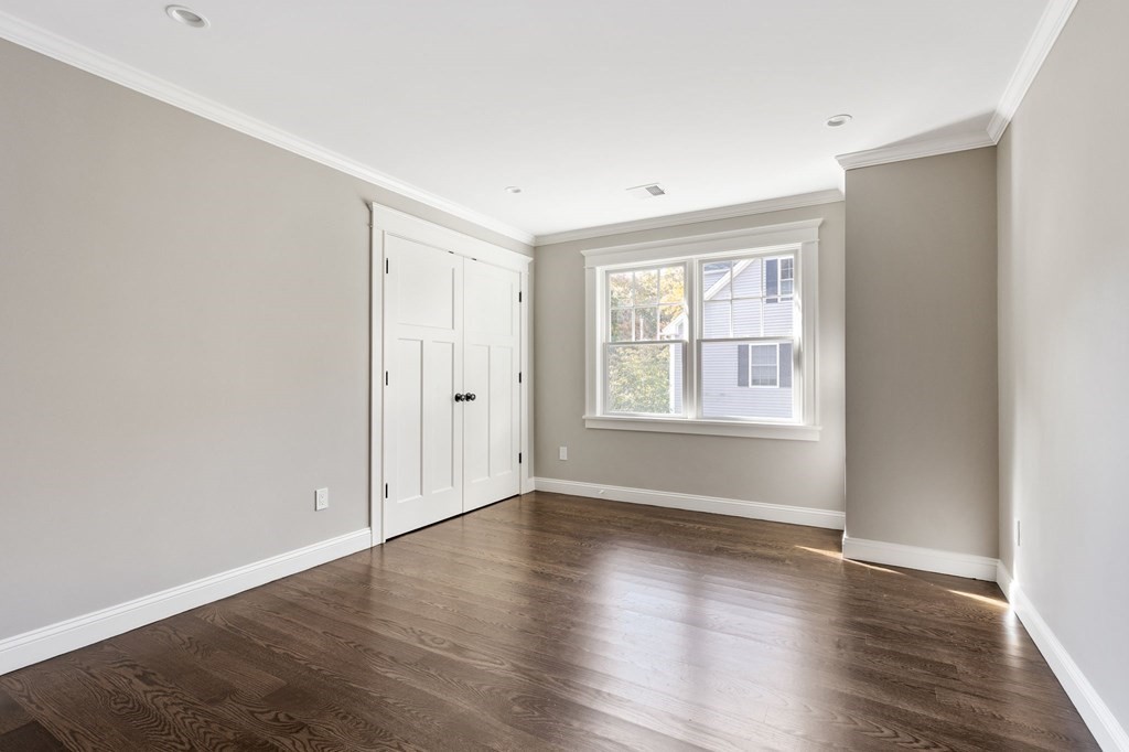 19 Turner Road Wellesley, MA 02482 - Photo 14 of 23 an empty room with wooden floor and windows