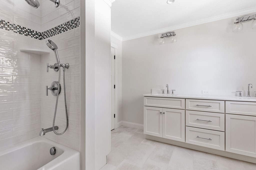 19 Turner Road Wellesley, MA 02482 - Photo 17 of 23 a bathroom with a granite countertop sink a mirror and a bathtub