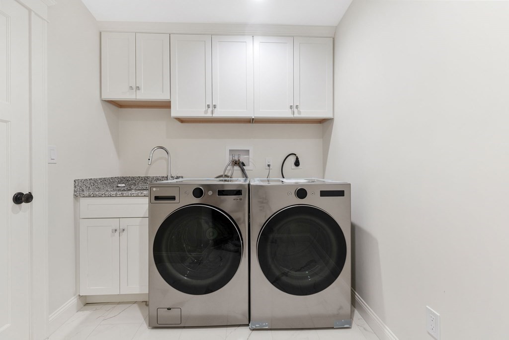 19 Turner Road Wellesley, MA 02482 - Photo 19 of 23 a utility room with dryer and washer