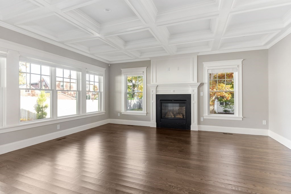 19 Turner Road Wellesley, MA 02482 - Photo 5 of 23 an empty room with wooden floor and a fireplace