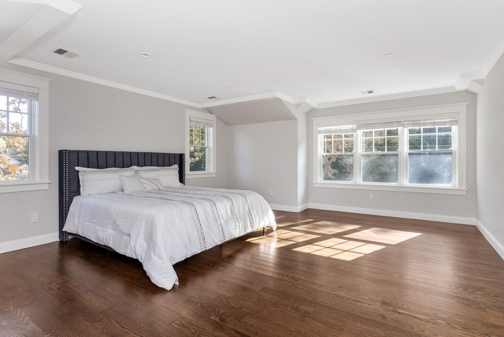19 Turner Road Wellesley, MA 02482 - Photo 9 of 23 a bedroom with a bed and wooden floor