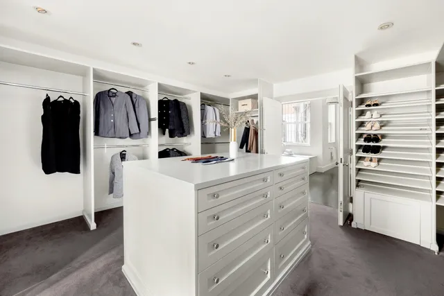 a bathroom with a double vanity sink and mirror