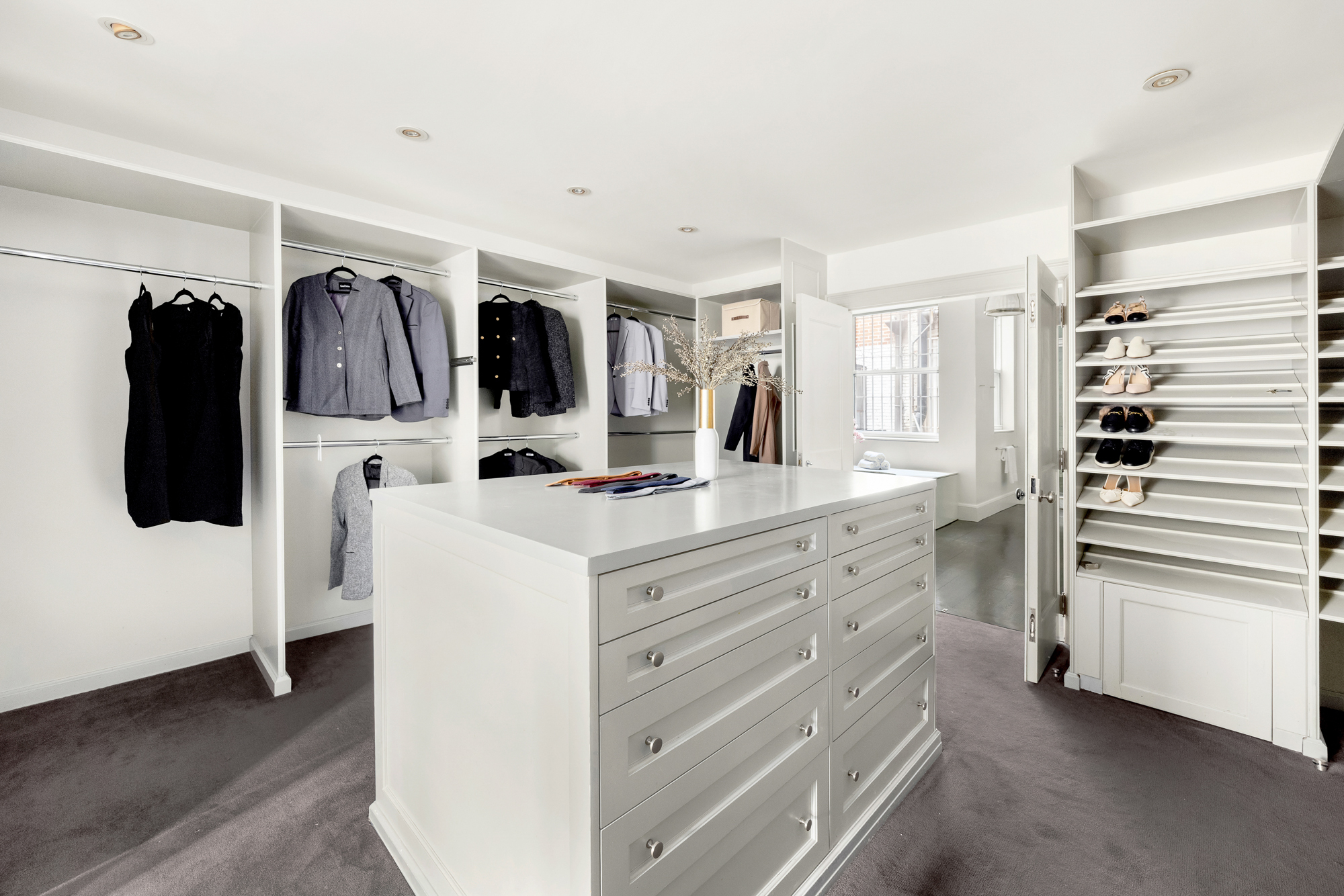 178 East 73rd Street Manhattan, NY 10021 - Photo 9 of 16 a bathroom with a double vanity sink and mirror