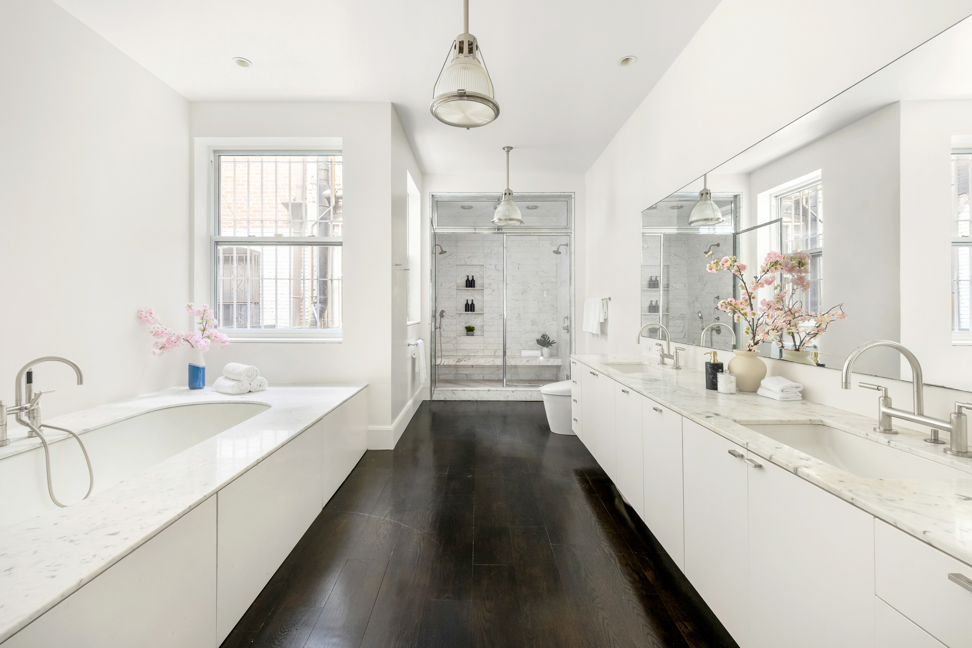 178 East 73rd Street Manhattan, NY 10021 - Photo 10 of 16 a large white kitchen with a large window