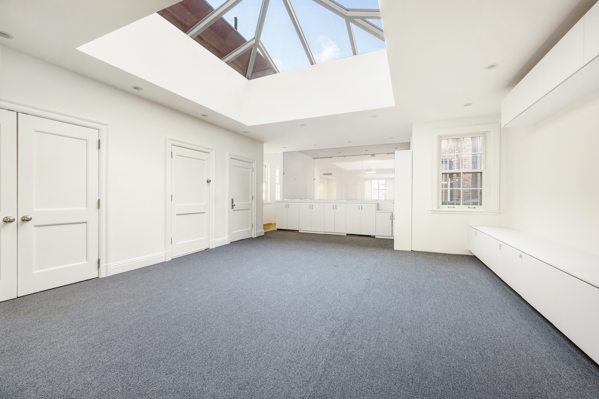 178 East 73rd Street Manhattan, NY 10021 - Photo 13 of 16 an empty room with windows