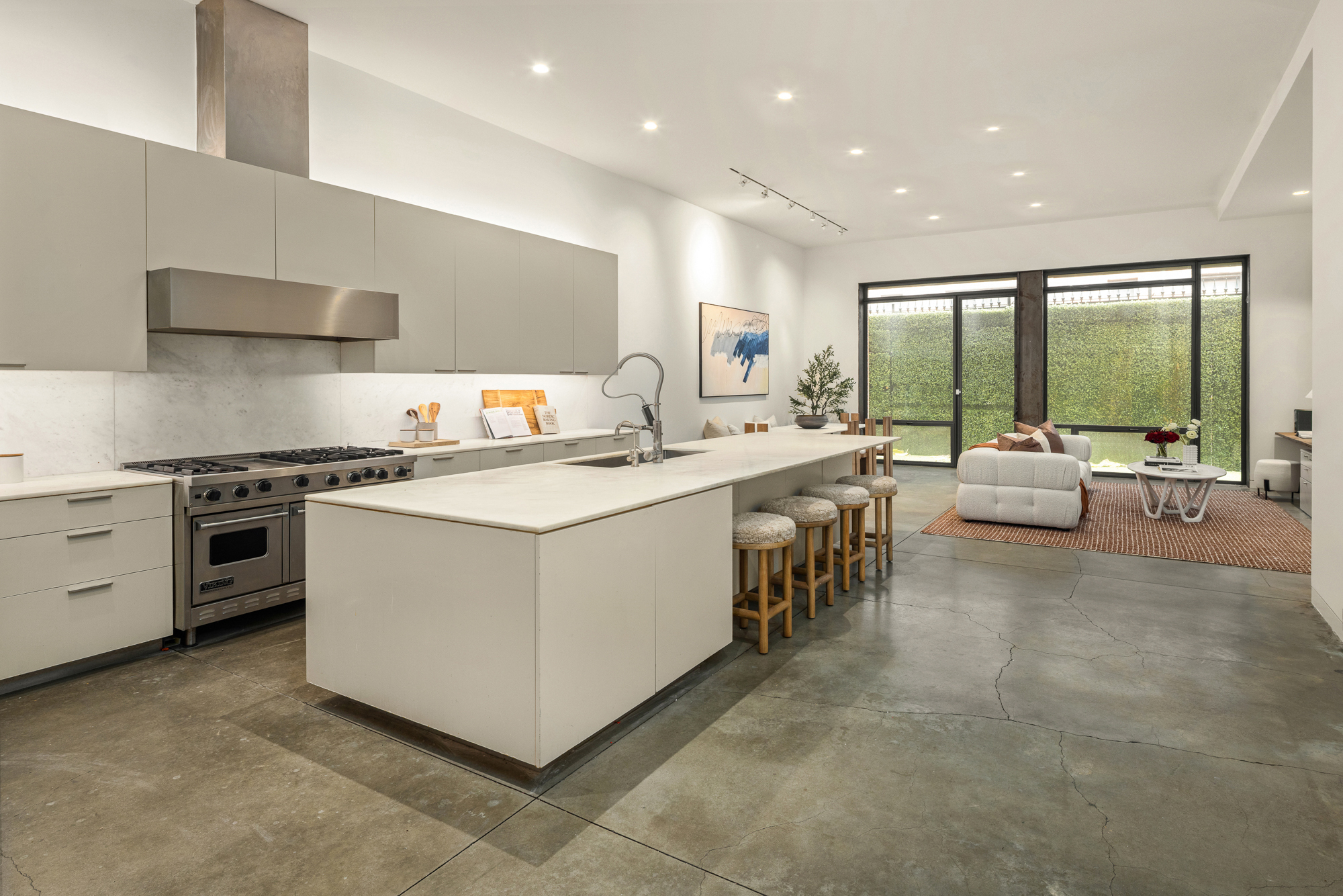 178 East 73rd Street Manhattan, NY 10021 - Photo 4 of 16 a large white kitchen with a large window