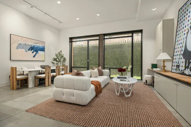 a large white kitchen with a large window