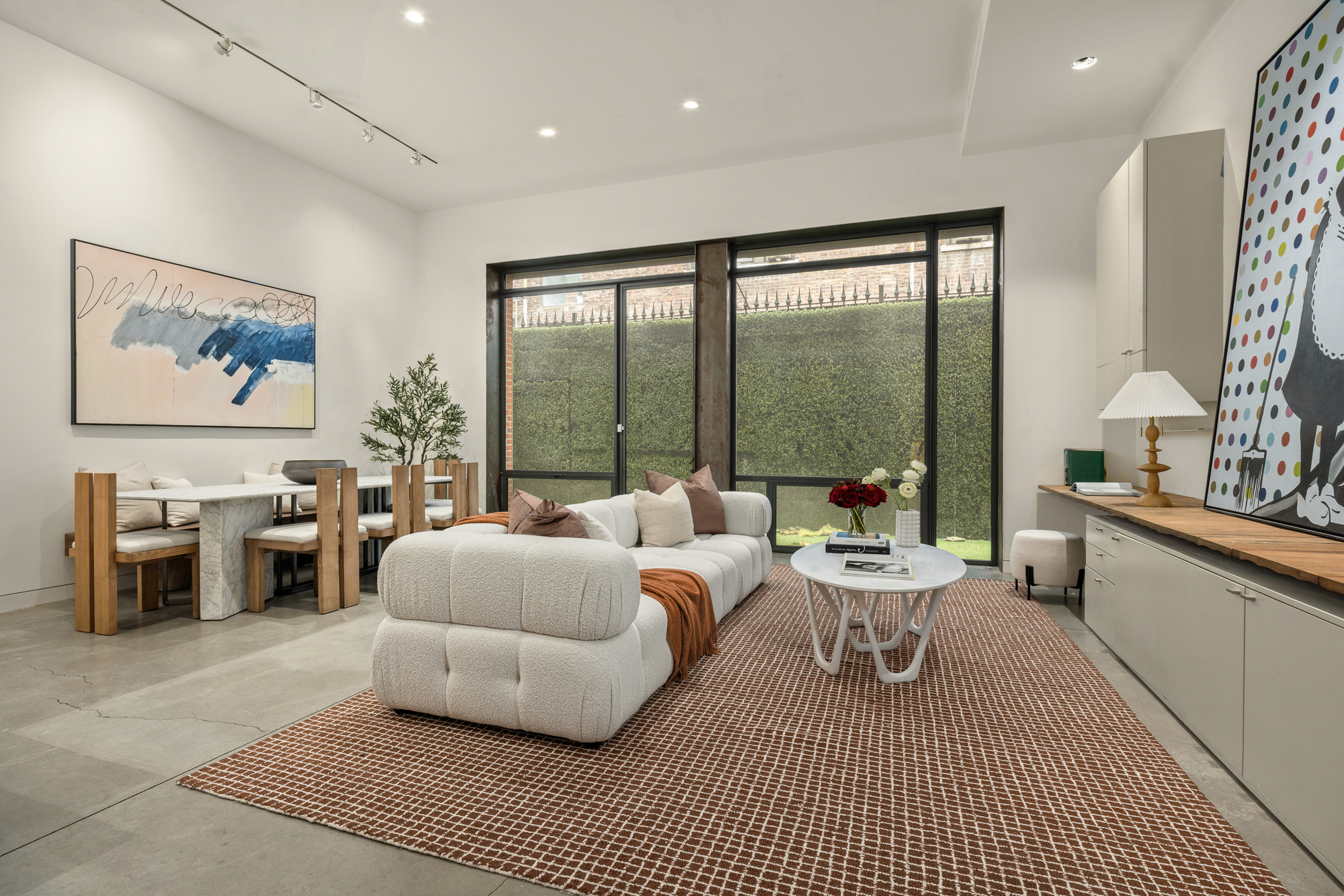 178 East 73rd Street Manhattan, NY 10021 - Photo 5 of 16 a living room with furniture large window and a table