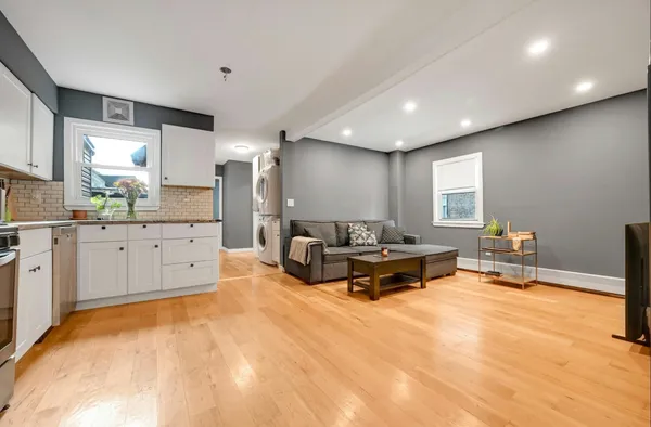 a living room with furniture and a large window