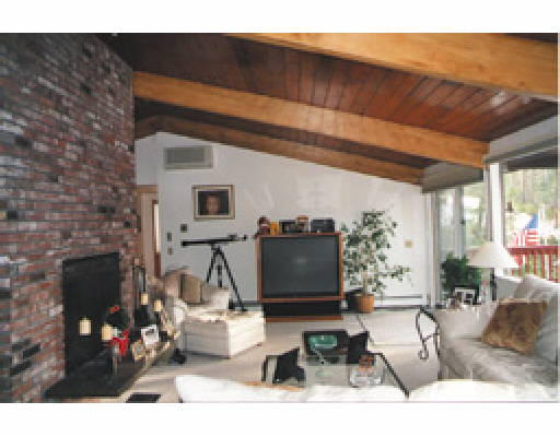25 Fire Road, Unit 7 Lancaster, MA 01523 - Photo 3 of 3 a living room with furniture a flat screen tv and a fireplace