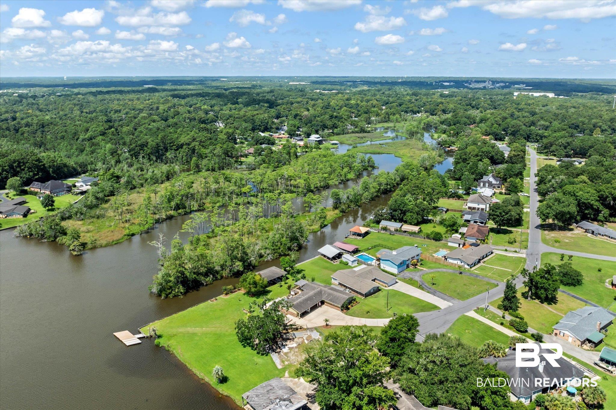 3801 Point Road Mobile, AL 36619 - Photo 49 of 55 Aerial perspective showcasing a residential area bordered by a body of water and dense woodlands