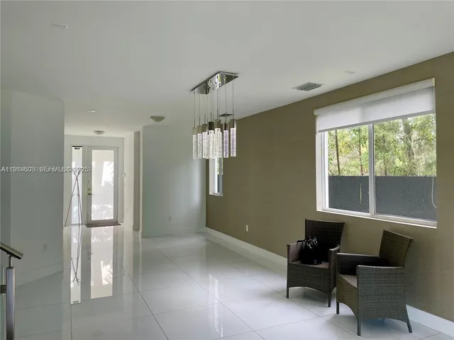 a view of a livingroom with furniture and windows