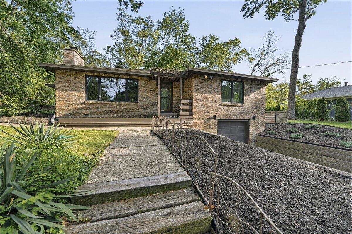 63 Ski Hill Road Portage, IN 46368 - Photo 1 of 28 a front view of a house with garden