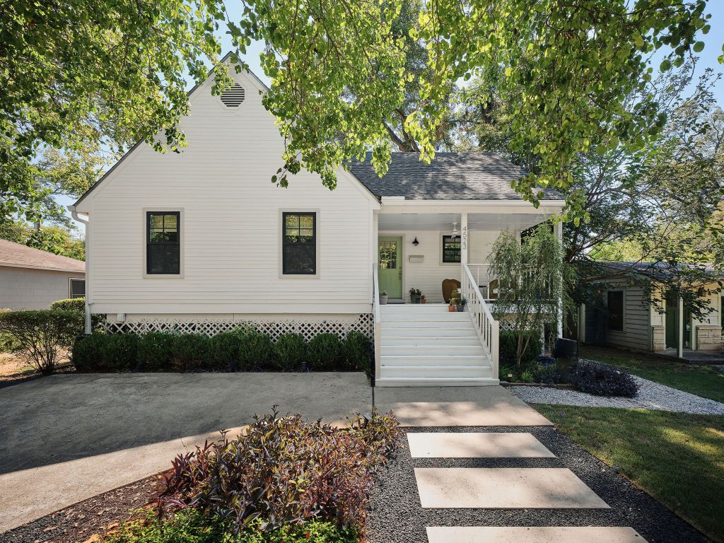 4523 Avenue D Austin, TX 78751 - Photo 1 of 1 a front view of a house with a garden and tree