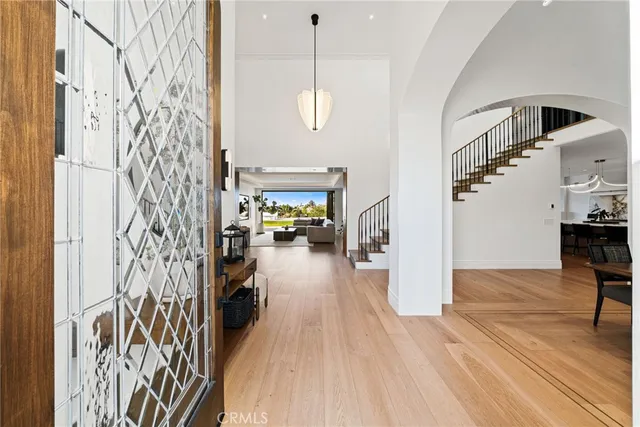 a kitchen with a stove and a wooden floor