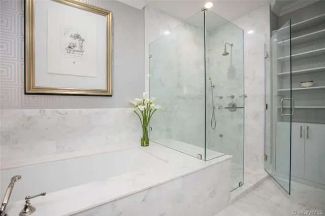 a bathroom with a bathtub and a shower