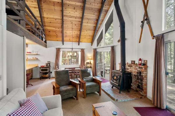 a living room with furniture or couch and a large window