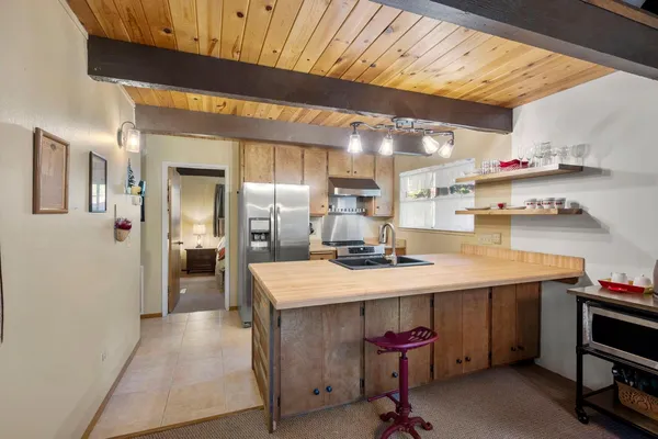 a kitchen with stainless steel appliances granite countertop a sink and cabinets