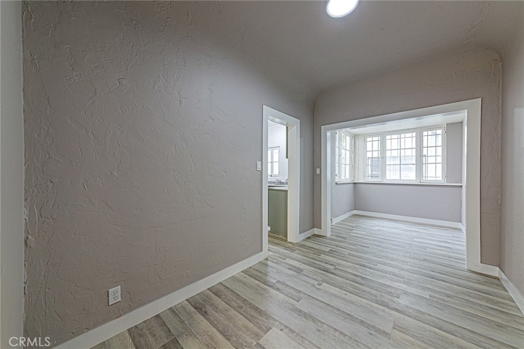 5355 West 8th Street Los Angeles, CA 90036 - Photo 25 of 32 wooden floor in an empty room with a window